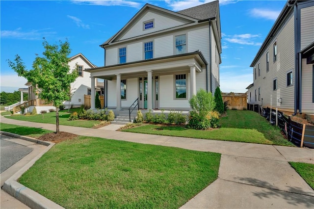 view of front facade featuring a porch and a front yard