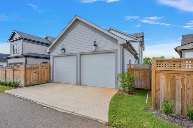 view of property exterior featuring an outdoor structure and a garage