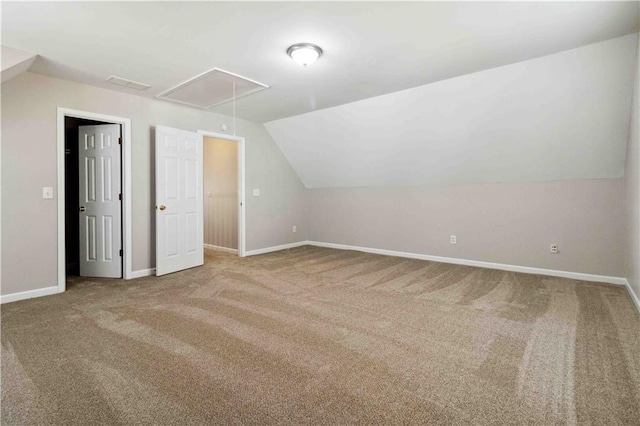 bonus room with carpet flooring and lofted ceiling