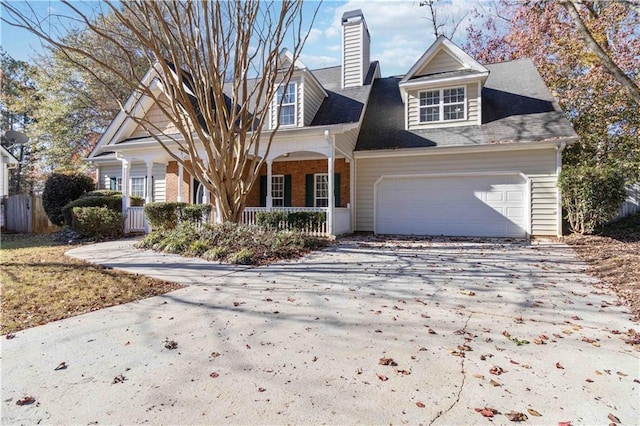 view of front of house featuring a garage and covered porch