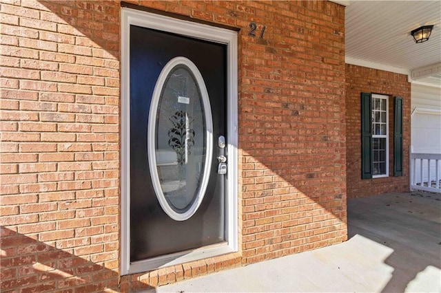 entrance to property featuring covered porch