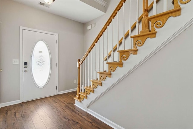 foyer entrance with dark wood-type flooring