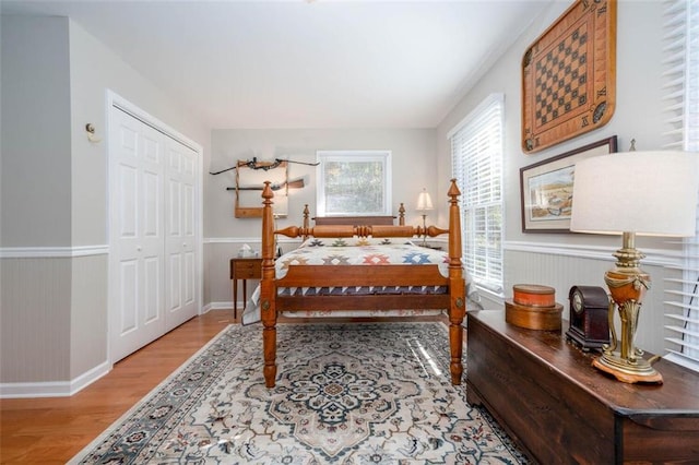 bedroom with a closet and hardwood / wood-style floors