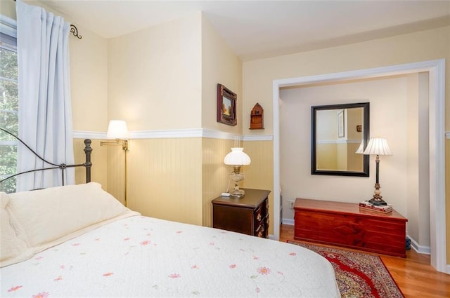 bedroom with wood-type flooring