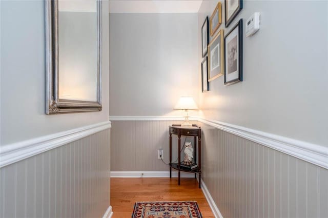 hallway with light hardwood / wood-style flooring