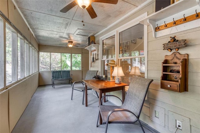 sunroom featuring ceiling fan