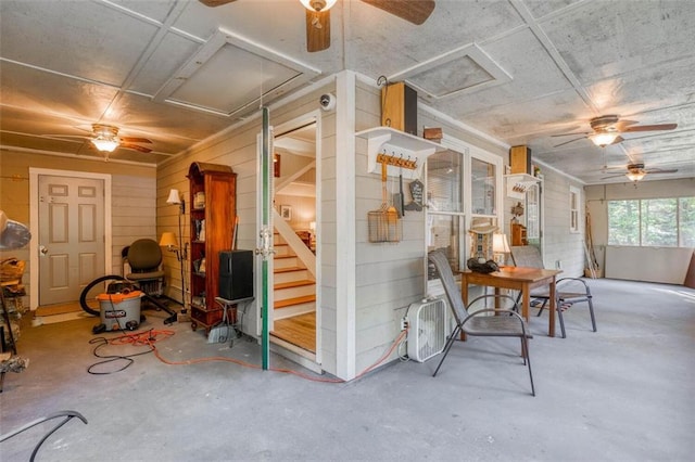 interior space featuring concrete floors and ceiling fan