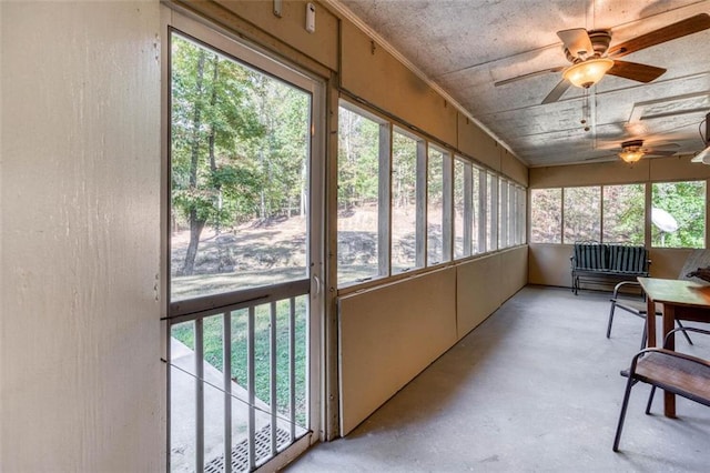 sunroom featuring ceiling fan