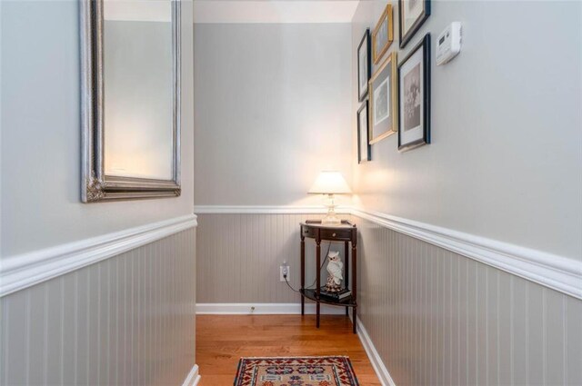 hall with light hardwood / wood-style flooring