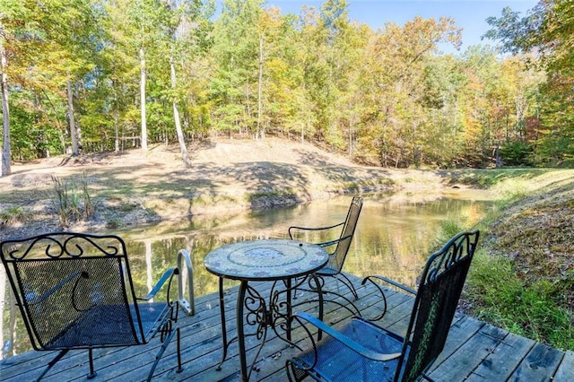 wooden deck featuring a water view