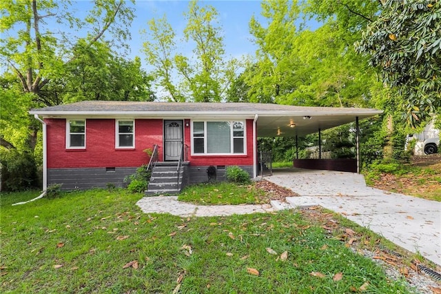 view of front facade with crawl space, driveway, a front yard, a carport, and entry steps