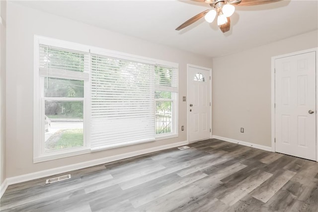 entrance foyer with a ceiling fan, baseboards, visible vents, and wood finished floors