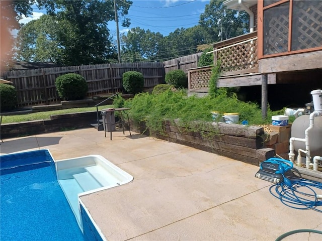 view of swimming pool with a patio area