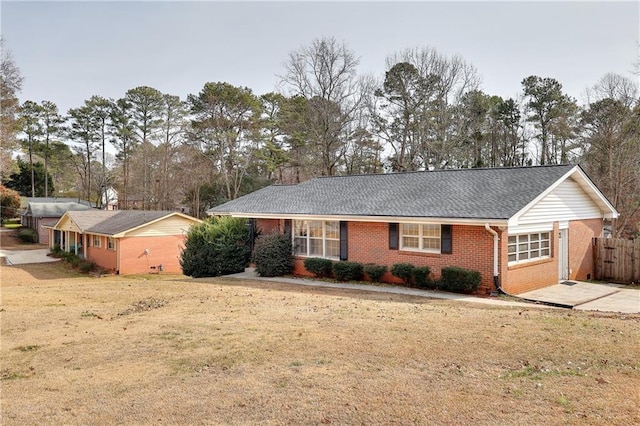 single story home featuring a front yard