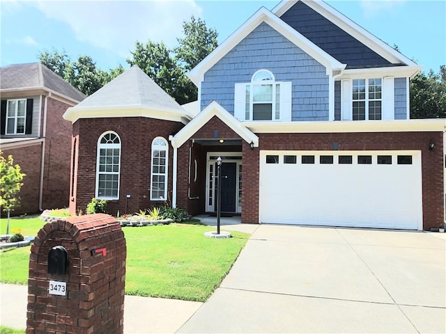 3473 Newtons Crest Cir, Snellville, GA 30078 - view of front of property featuring a front yard, concrete driveway, a garage, and brick siding