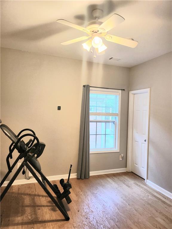 3473 Newtons Crest Cir, Snellville, GA 30078 - exercise room with wood finished floors and a ceiling fan