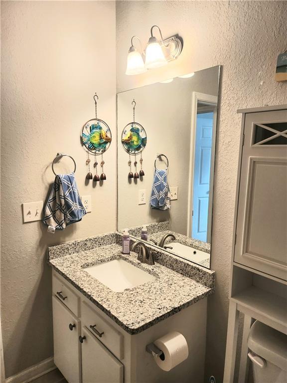 3473 Newtons Crest Cir, Snellville, GA 30078 - bathroom featuring vanity and a textured wall