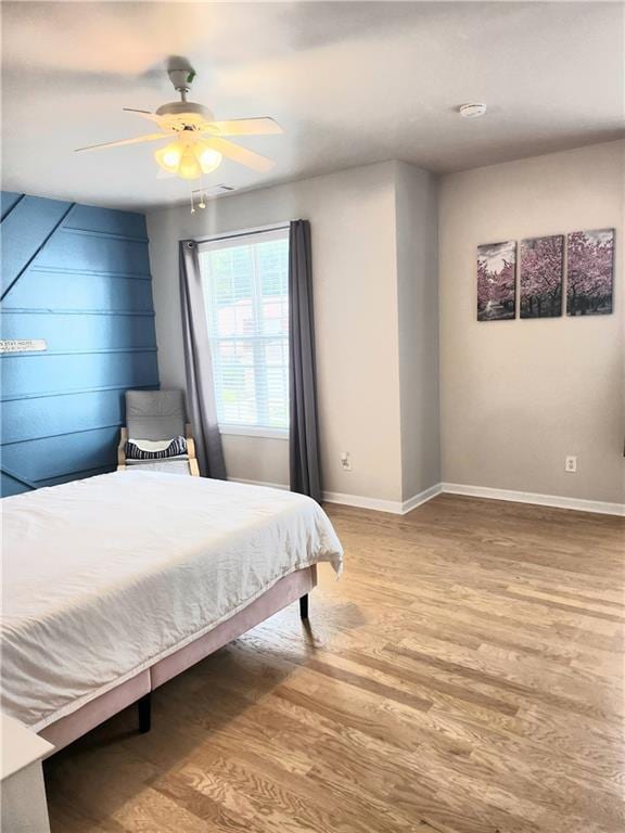 3473 Newtons Crest Cir, Snellville, GA 30078 - bedroom with light wood finished floors and ceiling fan
