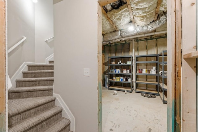 interior space featuring baseboards and concrete flooring