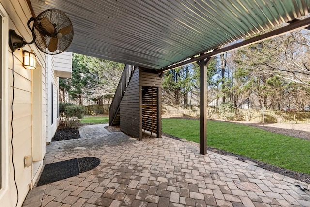 view of patio with stairway and a fenced backyard