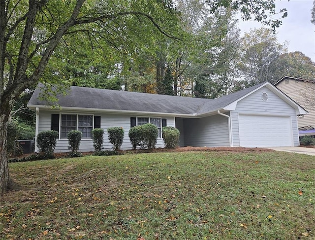 single story home with a garage and a front yard