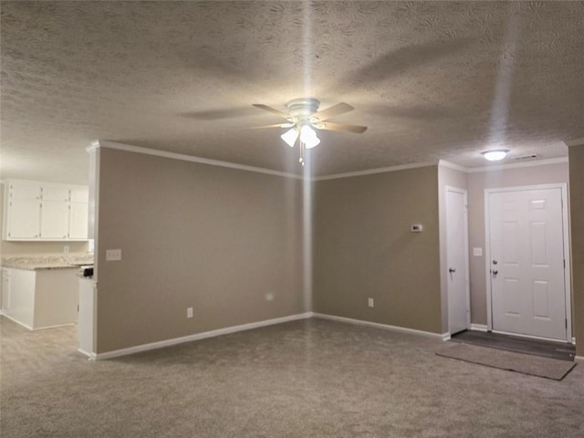 unfurnished living room featuring light colored carpet, a textured ceiling, and crown molding