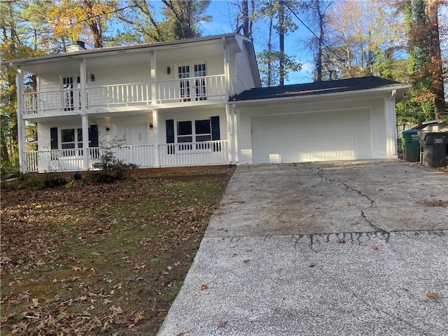 view of front of house featuring a balcony and a garage