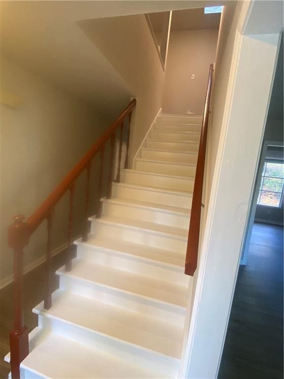 stairway with wood-type flooring