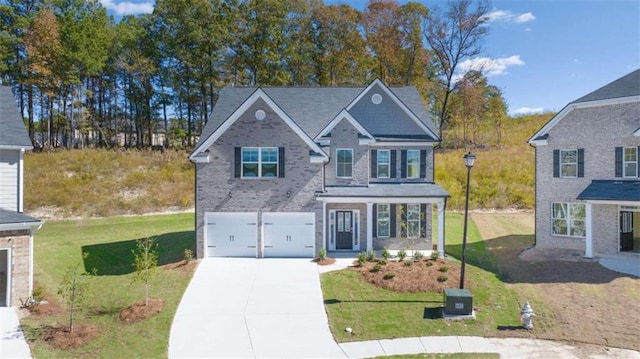 view of front facade featuring a front lawn and a garage