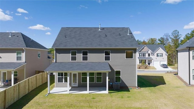 back of property with a patio, a lawn, and central AC unit