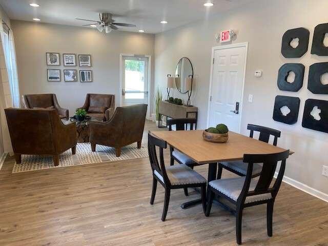 dining area with light hardwood / wood-style floors and ceiling fan