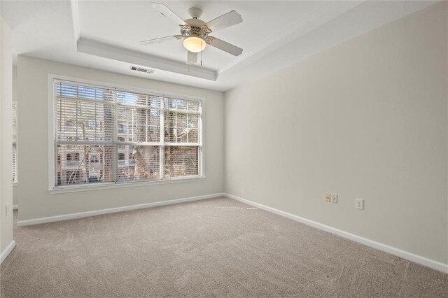 1024 Whitshire Way, Alpharetta, GA 30004 - unfurnished room featuring a tray ceiling, carpet floors, and a ceiling fan