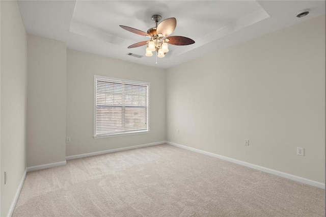 1024 Whitshire Way, Alpharetta, GA 30004 - unfurnished room featuring light carpet, a ceiling fan, and a raised ceiling