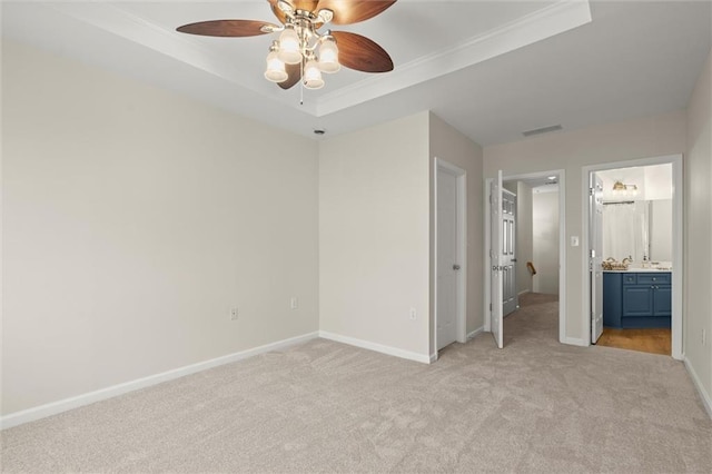 1024 Whitshire Way, Alpharetta, GA 30004 - unfurnished bedroom with a tray ceiling, light carpet, connected bathroom, ornamental molding, and ceiling fan