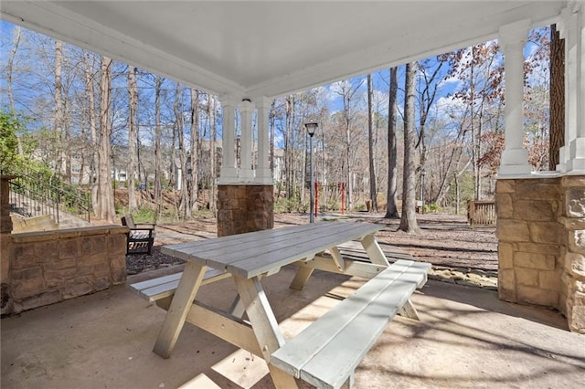 1024 Whitshire Way, Alpharetta, GA 30004 - view of patio / terrace with outdoor dining space and view of scattered trees