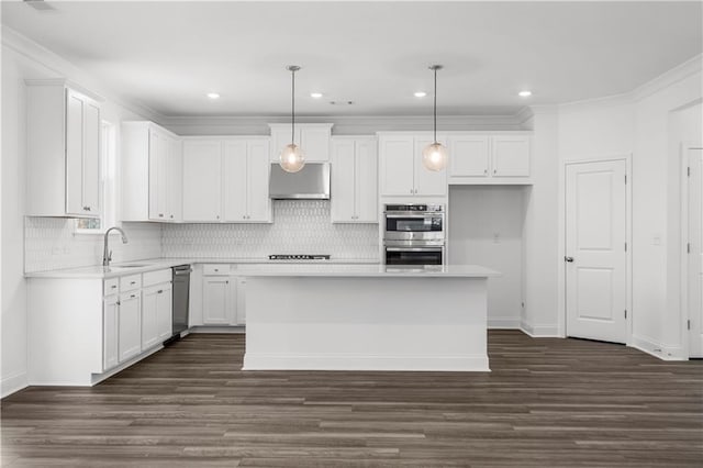 1495 Auburn Glen Rd, Dacula, GA 30019 - kitchen with stainless steel appliances, under cabinet range hood, white cabinetry, light countertops, and recessed lighting