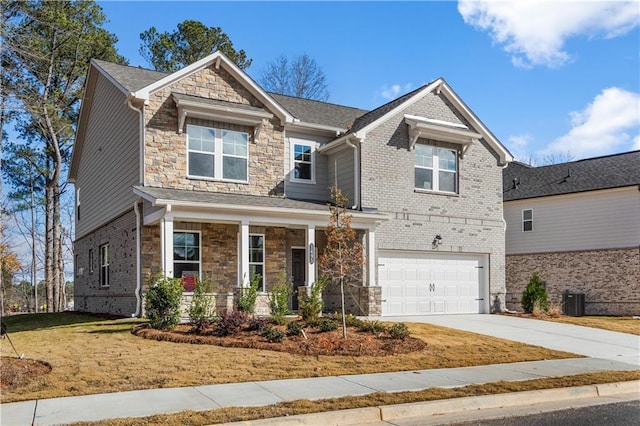 craftsman inspired home with a garage, a porch, central AC unit, and a front lawn