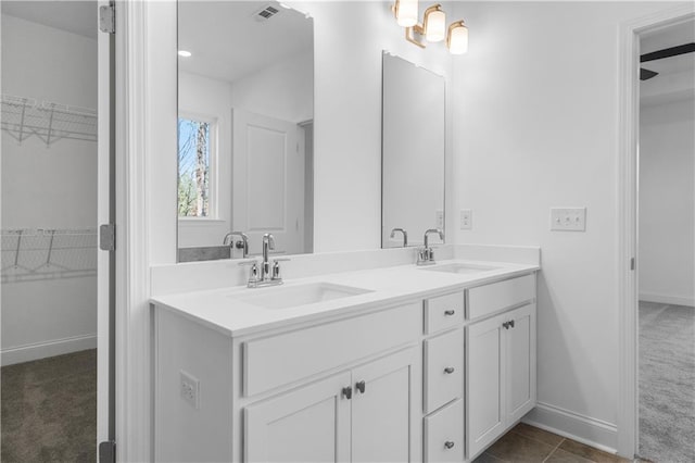 bathroom with vanity and tile patterned flooring