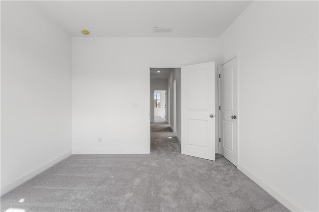 empty room featuring light colored carpet