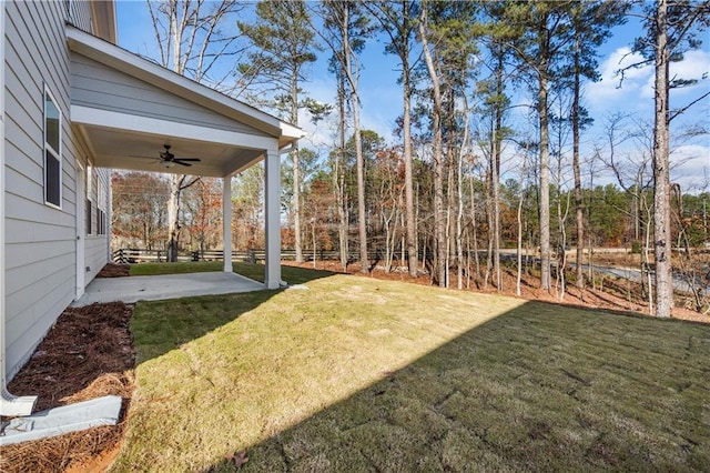 view of yard featuring a patio and ceiling fan