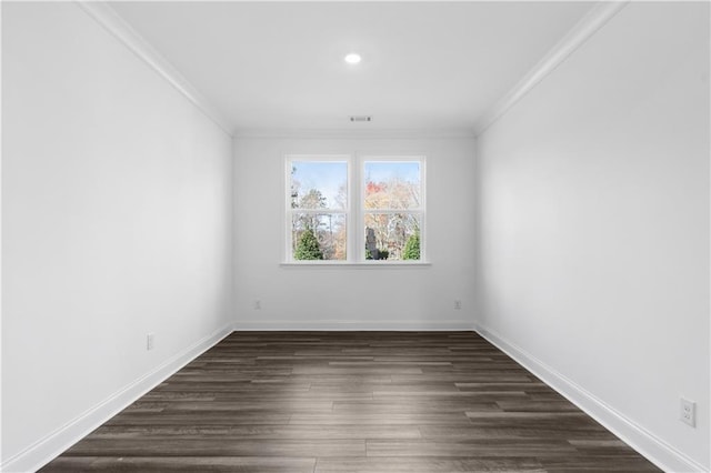 unfurnished room with crown molding and dark wood-type flooring