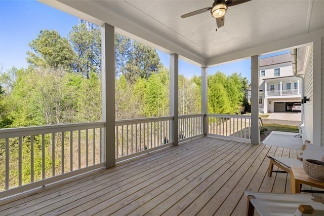 wooden deck featuring a ceiling fan