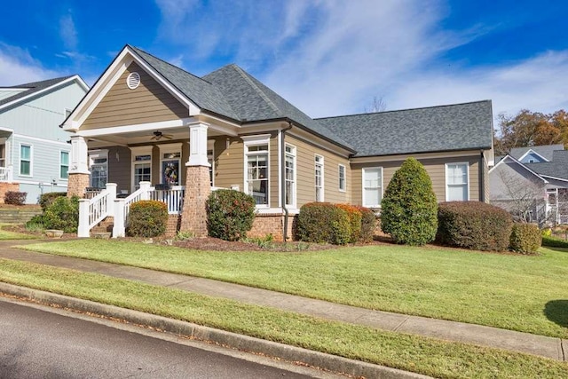 view of front of house with a porch and a front lawn