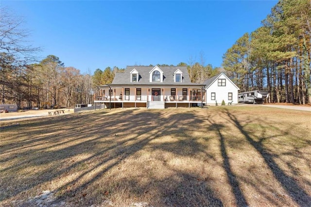 view of front of home featuring covered porch and a front yard