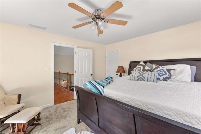 bedroom featuring ceiling fan and light colored carpet