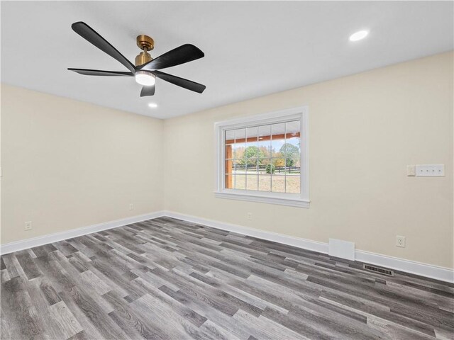 239 Brown Dr, Clermont, GA 30527 - unfurnished room featuring a ceiling fan, visible vents, wood finished floors, baseboards, and recessed lighting