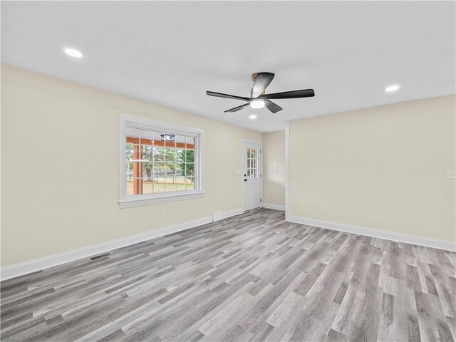 239 Brown Dr, Clermont, GA 30527 - empty room featuring wood finished floors, a ceiling fan, baseboards, and visible vents