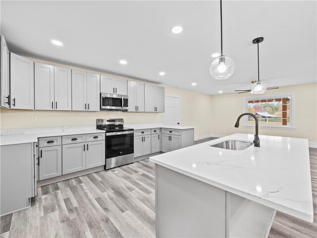 239 Brown Dr, Clermont, GA 30527 - kitchen with recessed lighting, light wood-style flooring, appliances with stainless steel finishes, and a sink