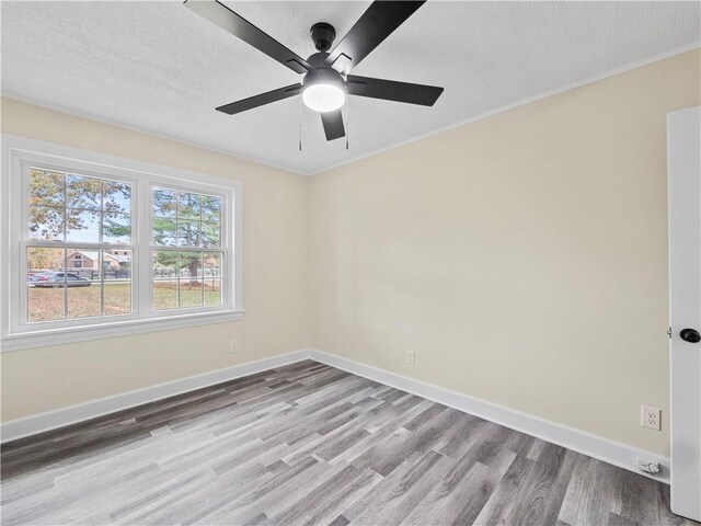 239 Brown Dr, Clermont, GA 30527 - empty room featuring ceiling fan, baseboards, a textured ceiling, and wood finished floors