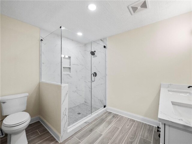 239 Brown Dr, Clermont, GA 30527 - bathroom with visible vents, toilet, baseboards, and wood tiled floor